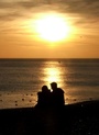 Couple by the water at sunset FREE Stock Photo, couple, love, romance picture