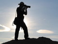 Silhouetted photographer at sunset FREE Stock Photo, photographer, silhouette, sunset picture
